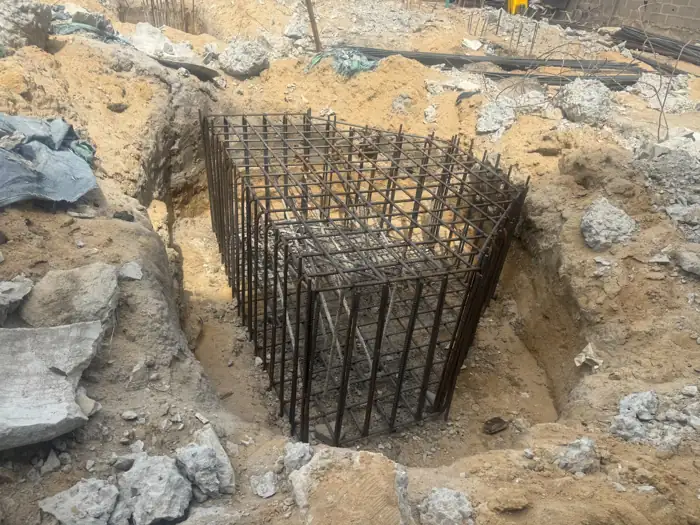 Reinforcement cage in a Crescent foundation excavation, construction photograph, April 2026
